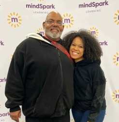 GentleWay co-founder Bert with team member Brittany at a learning conference