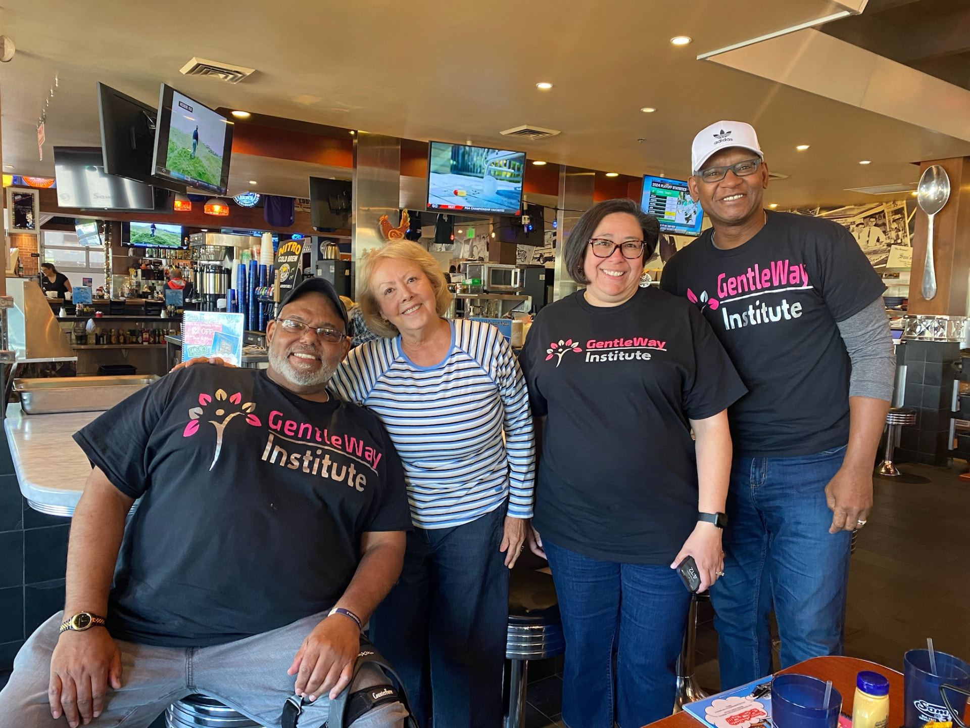 The GentleWay Institute team together in branded shirts before a client engagement